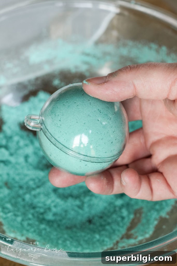 How to Make Bath Bombs with Printable Gift Tags 9 DIY Bath Bombs - add mixture to each side of the mold and then press them together