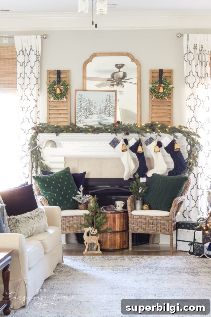 Minimalist Christmas Mantel Decorating Ideas 7 Green and Navy Simple Christmas Mantel - pretty gold bells, cable knit stockings and beautiful velvet pillows