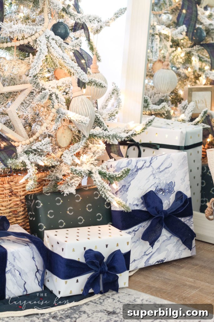 Flocked Plaid Christmas Tree Decorating Ideas 8 Beautiful blues and greens in the wrapping paper coordinate perfectly with the Christmas decor! Flocked Christmas Tree with Navy and Green plaid ribbon