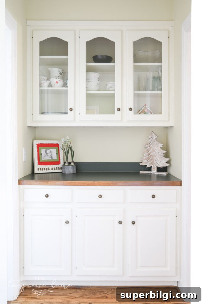 Our New Home Tour: Design, Layout and Renovation Details 10 Butler's pantry with glass-front cabinets and hunter green countertops.
