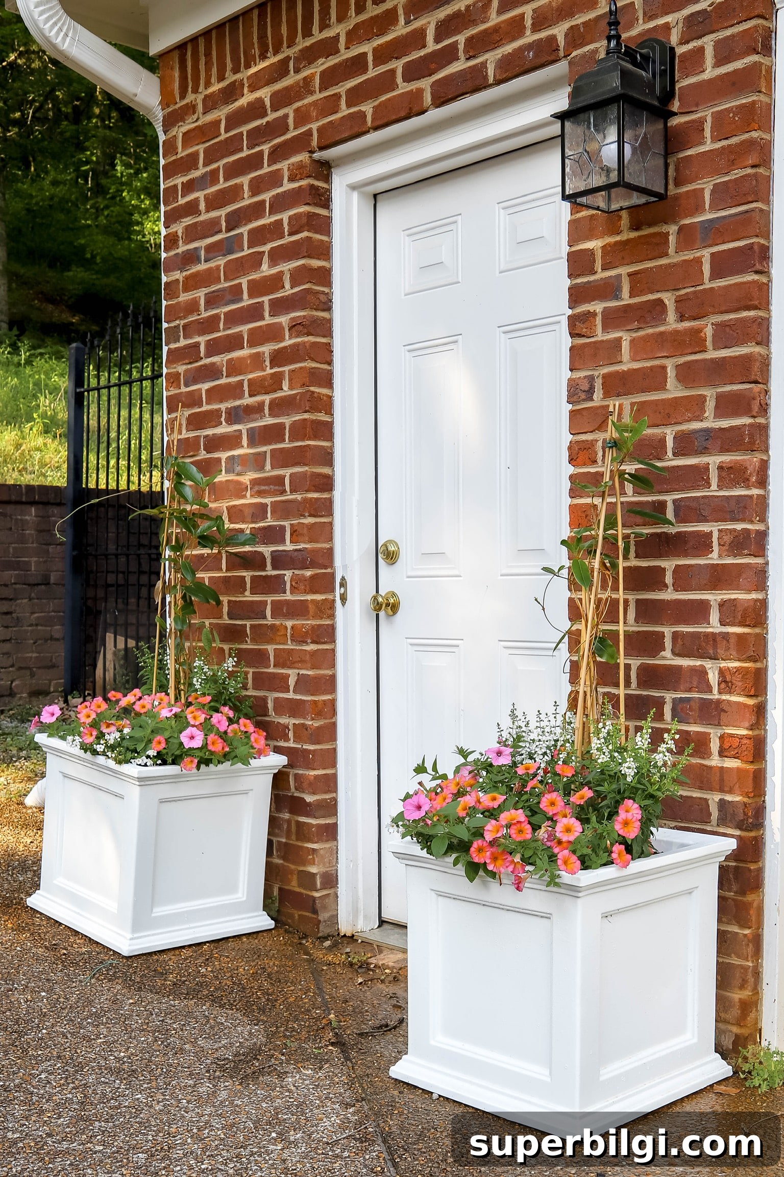 brick house with white planters flanking back door