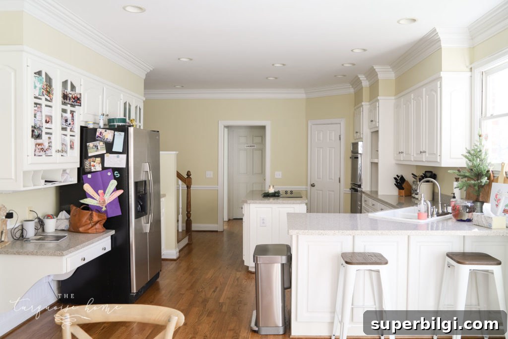 The kitchen in our new home that needs all new paint!