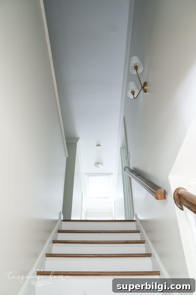 Modern Wall Sconces: Affordable Lighting for Every Room 4 New Stairwell Lighting: Brass Double Sconce - Modern Sconce Lighting for Every Budget - leading up the stairs