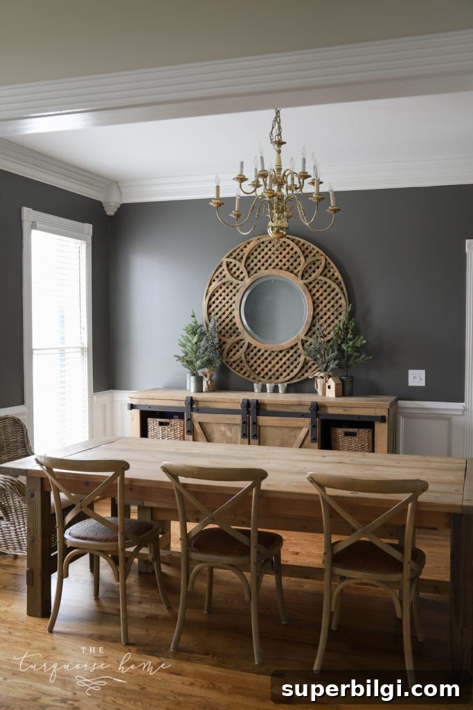 Benjamin Moore Kendall Charcoal Paint Color Guide 4 Benjamin Moore Kendall Charcoal in the Dining Room | A dark and moody dining room with white trim and brass & wood accents