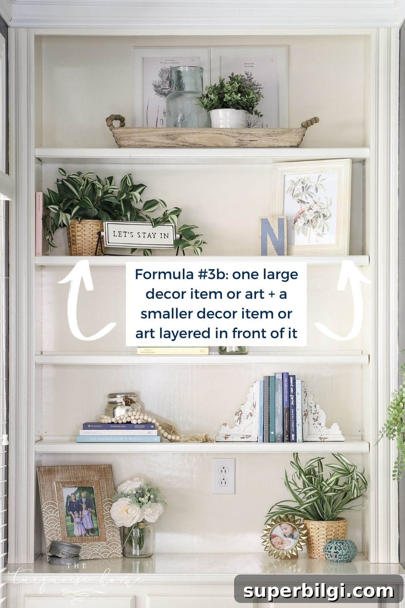 White built-in bookshelves with greenery, art and books!