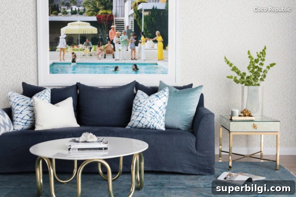 Choose and Arrange Sofa Pillows for Living Room Decor 3 blue couch sitting in a living room with multi colored square throw pillows on it