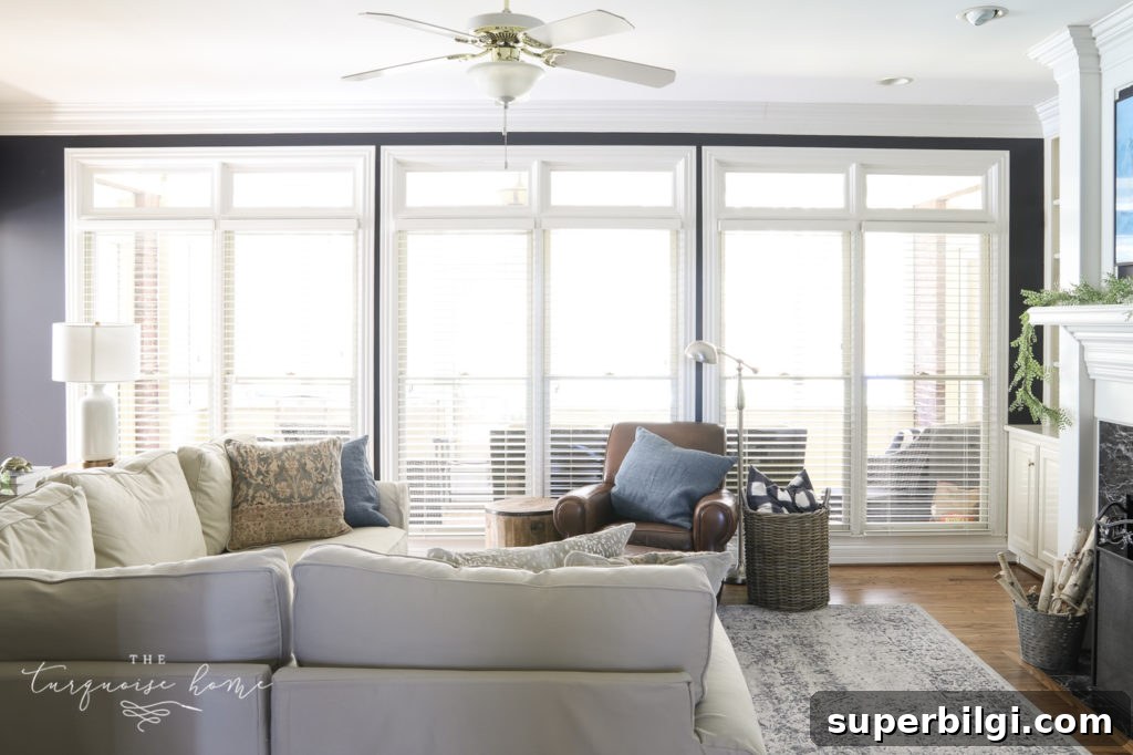 Measure and Install an Extra-Long Curtain Rod 2 Hale Navy Walls and a Wall of windows without curtains.