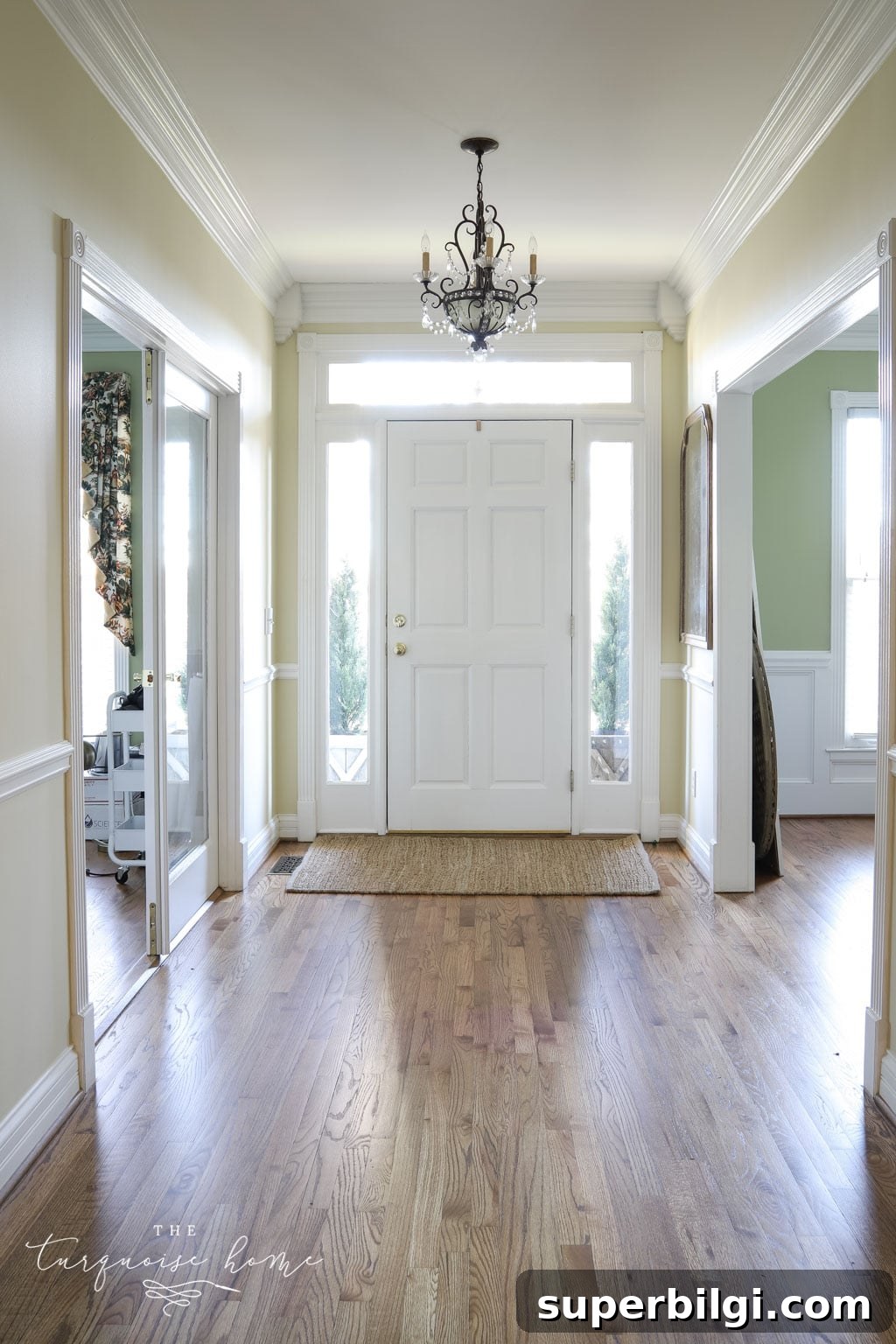 17 Stylish Entryway Lighting Fixtures for Quick Installation 3 Entry way in new house with brown hardwood floors.