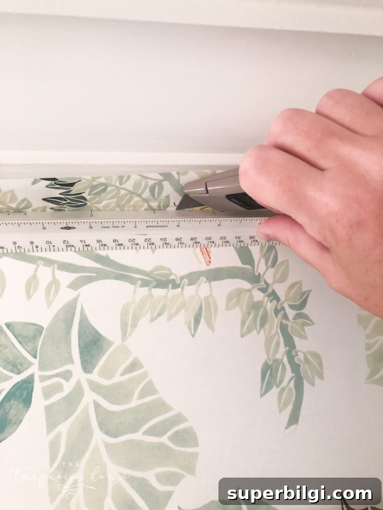 How to Hang Pre-Pasted Wallpaper: A Beginner's Guide 7 cut off excess wallpaper