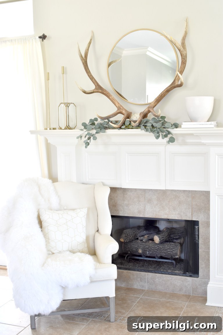 25 Spring Mantel Decor Ideas to Refresh Your Home 14 spring mantel decor with antlers, eucalyptus leaves, and a circle mirror