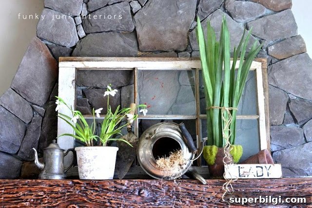 25 Spring Mantel Decor Ideas to Refresh Your Home 27 a collection of antique pieces mixed with fresh greenery for springtime mantel decor