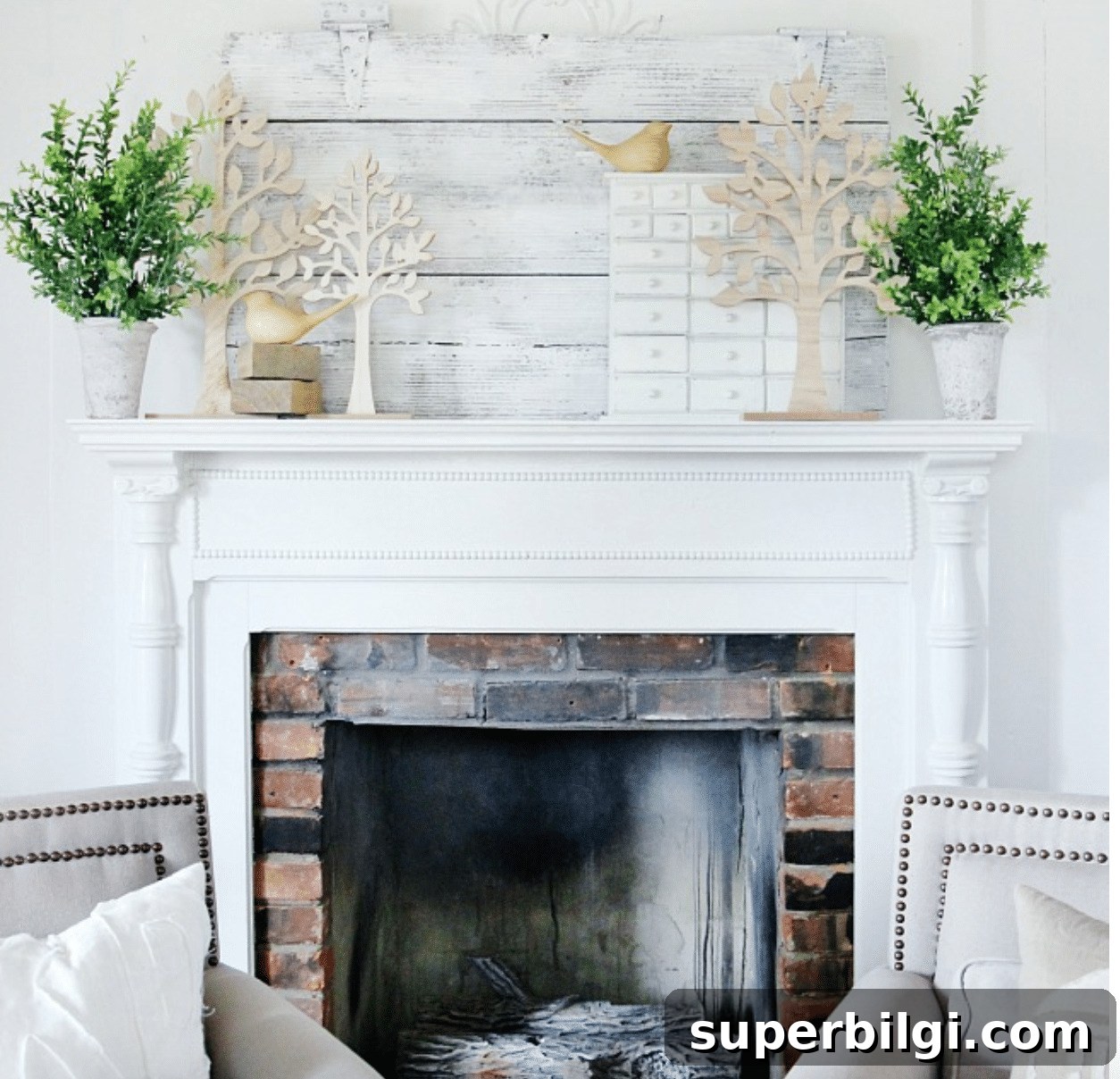25 Spring Mantel Decor Ideas to Refresh Your Home 7 spring mantel decor with tree cut outs, greenery, and bird figurines