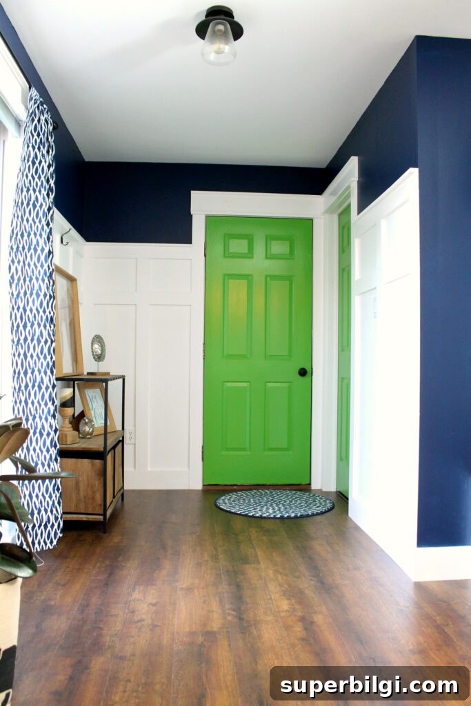 Interior Door Paint Colors That Transform Your Home 12 mud room with navy walls, white trim, and bright green interior doors