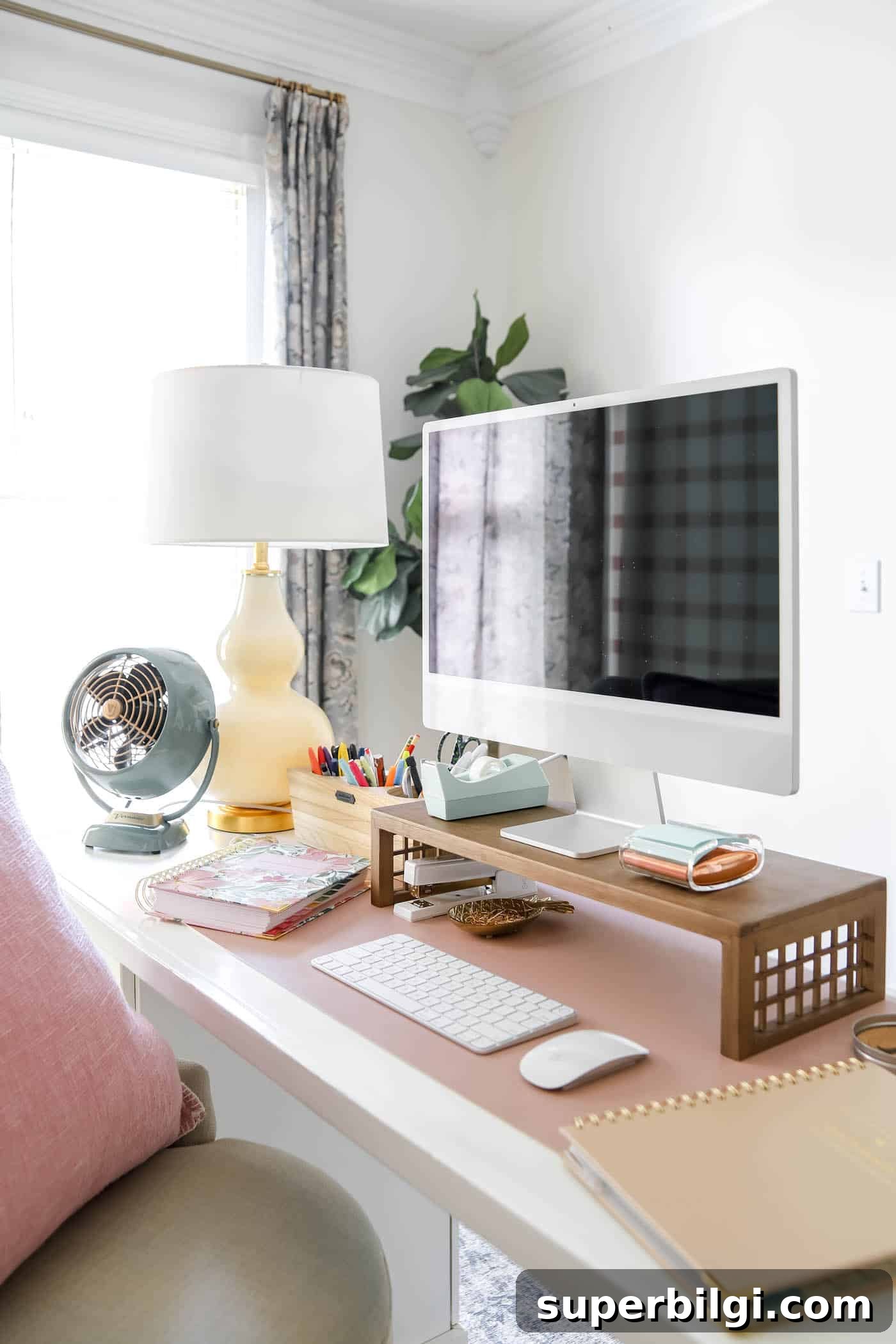 10 Office Decor Ideas to Transform Your Workspace 24 organized desk space with mc computer and desk riser, fan and lamp.