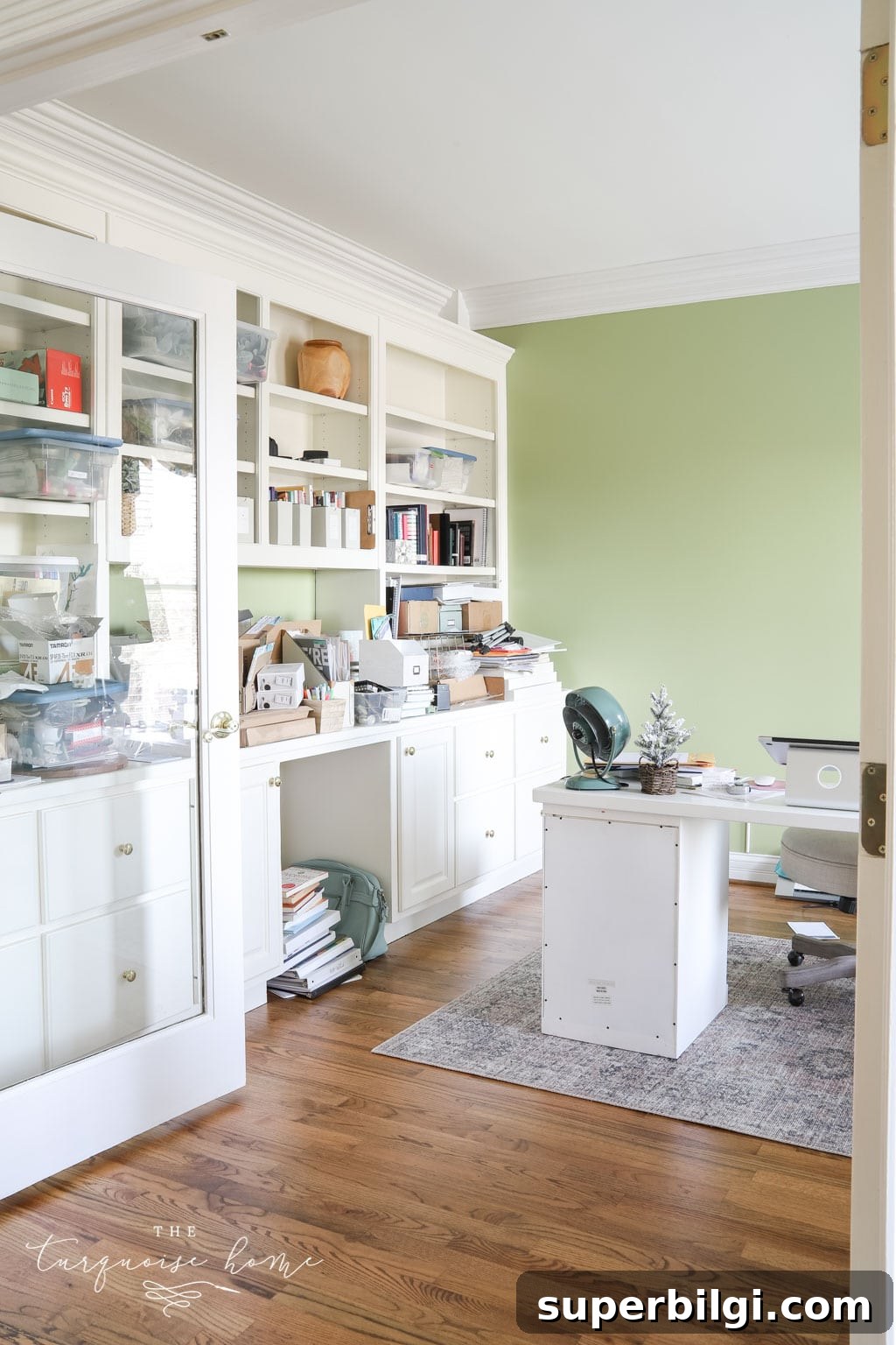 10 Office Decor Ideas to Transform Your Workspace 5 Lime green feminine office with built-in bookshelves.