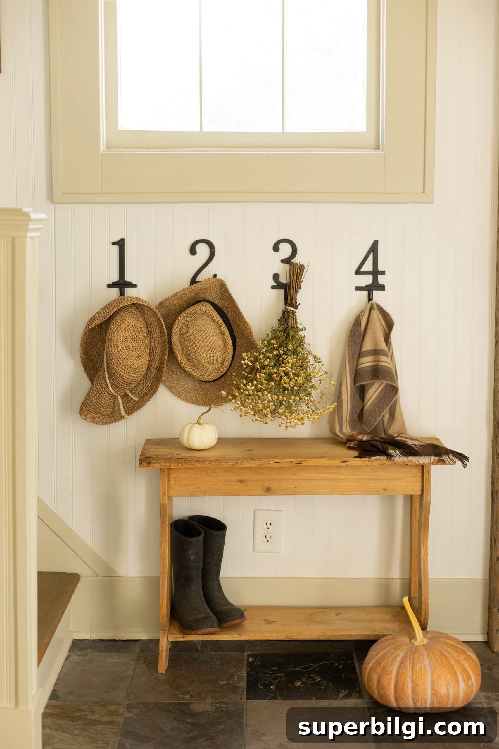 15 Space-Saving Storage Ideas for Small Entryways 11 numbered hooks in entryway from pine and prospect home
