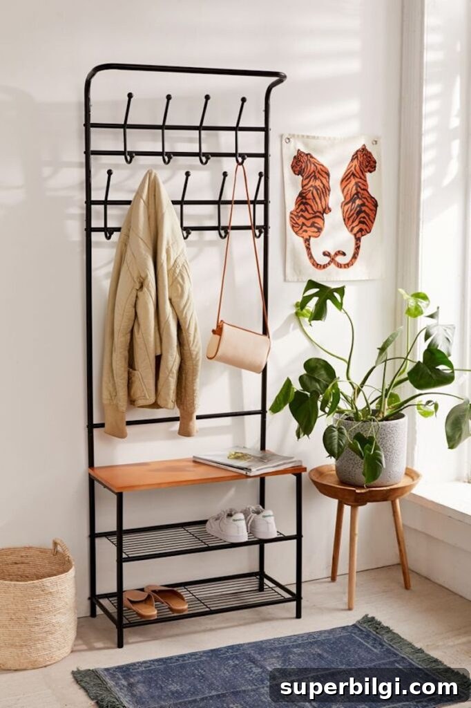 15 Space-Saving Storage Ideas for Small Entryways 21 All-in-one entryway storage rack, styled with a plant and tiger art piece.