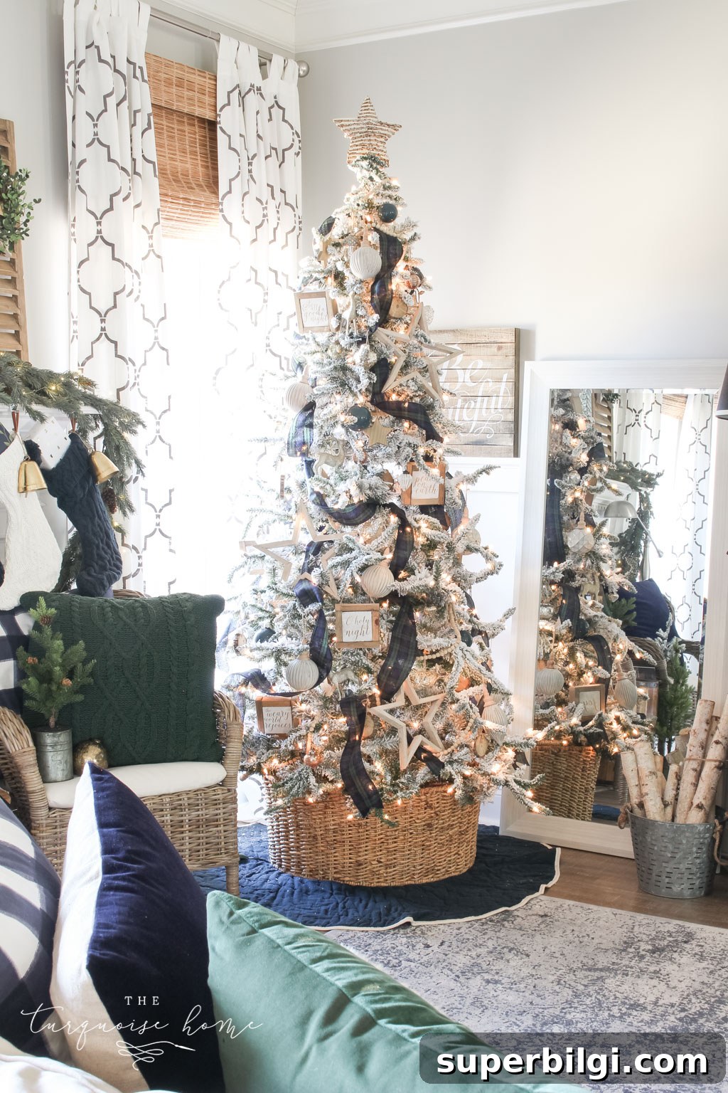 Christmas Tree Collar Ideas 2025: Creative and Festive 12 Gorgeous Flocked Christmas Tree with navy and green plaid ribbon and a basket tree collar.