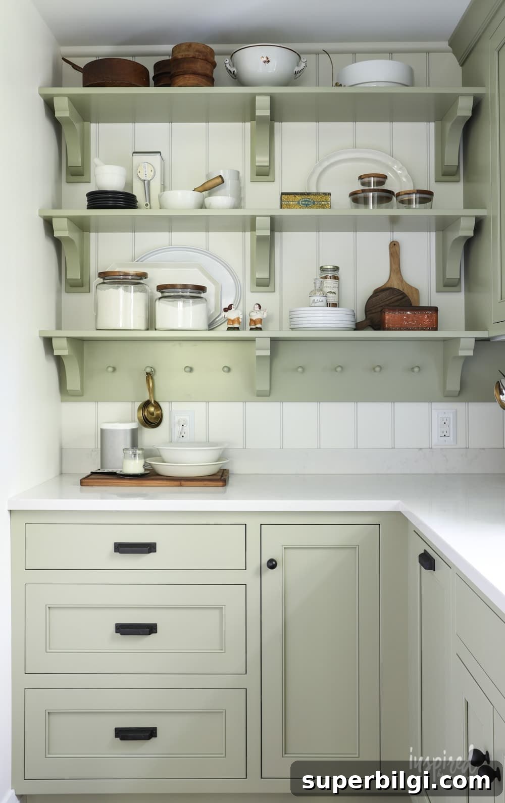 Green Paint Colors That Transform Your Home 10 Kitchen cabinets and open shelving in Sage by Sherwin Williams.