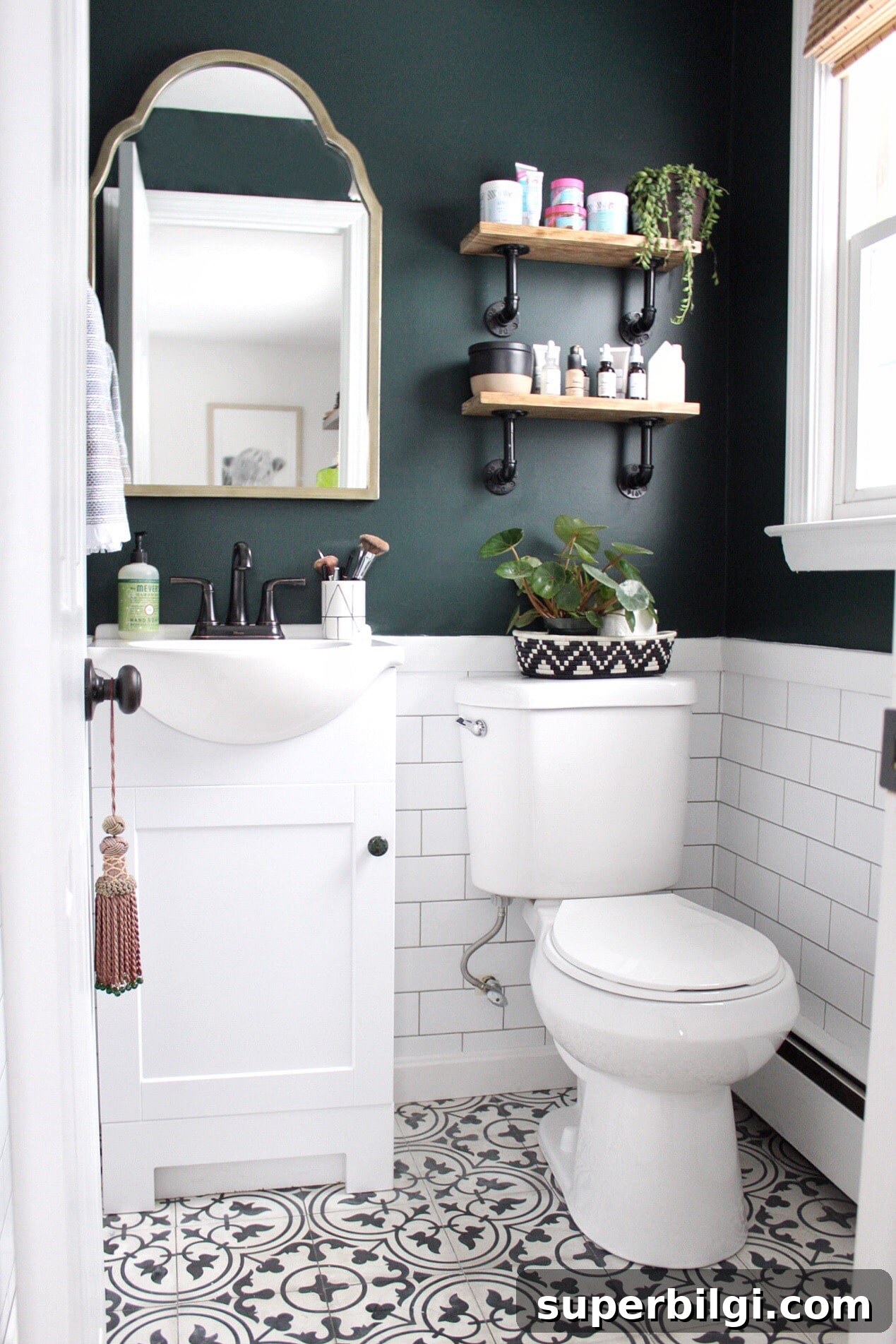 Green Paint Colors That Transform Your Home 19 Powder room with white subway tile and upper walls painted Salamander by Benjamin Moore.