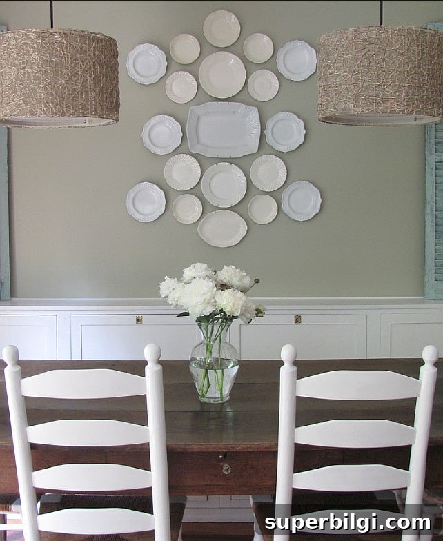 Green Paint Colors That Transform Your Home 7 Gray Mirage by Benjamin Moore is actually a sage green paint color, as shown in this country-chic dining room.
