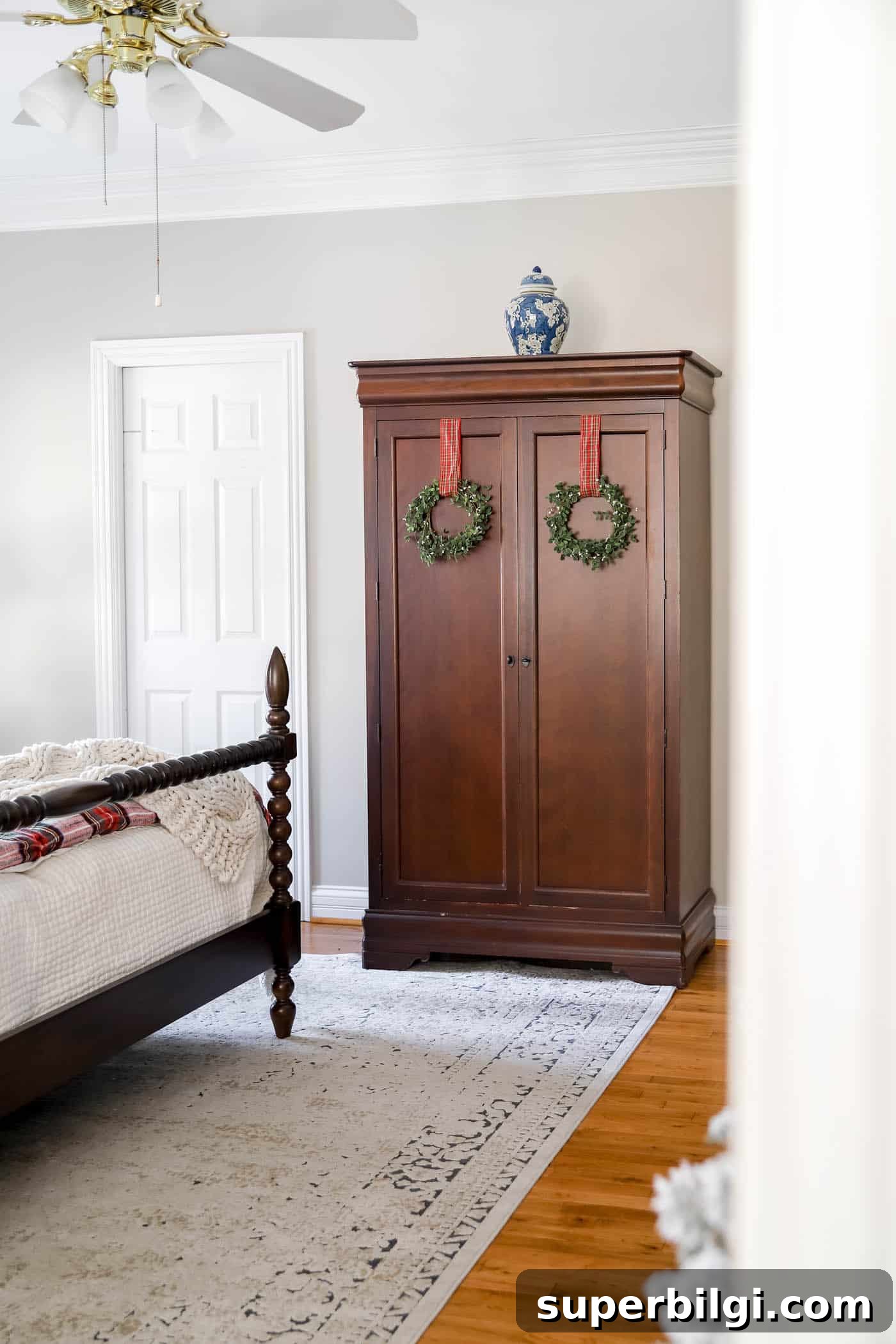 Cozy Christmas Bedroom Decorating Ideas and Inspiration 8 Wreaths on the armoire in Christmas bedroom