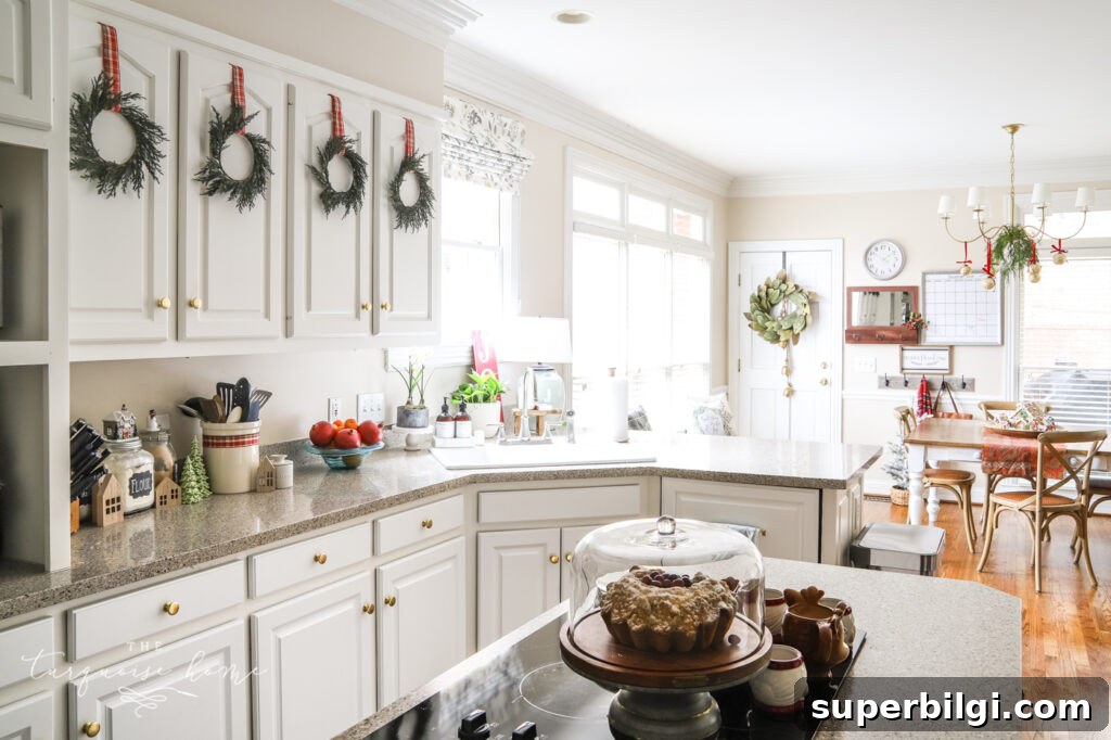 Transform Your Kitchen for Christmas in 3 Steps 4 Christmas Wreaths on White Kitchen Cabinets
