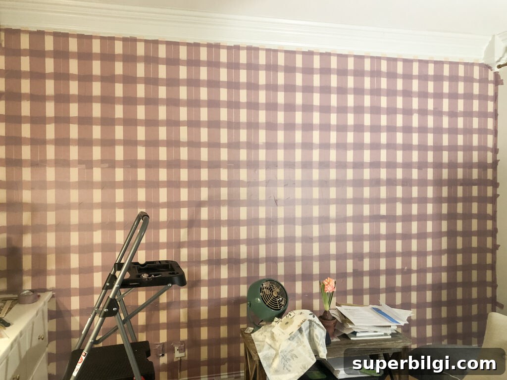 Step-by-Step DIY Plaid Accent Wall Tutorial 12 Painting a plaid wall