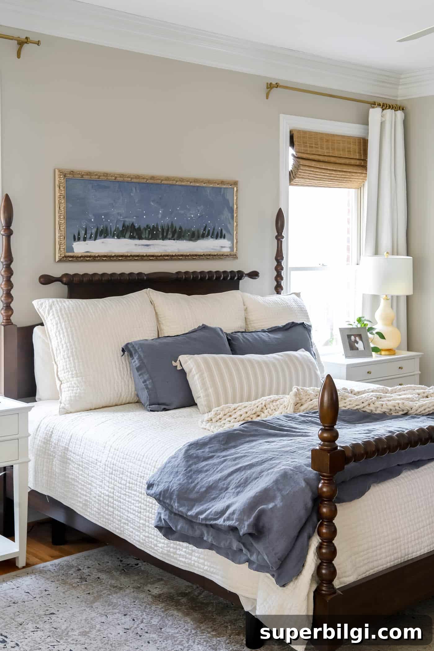 How to Make Your Bed Like a Pro in 6 Steps 4 primary bedroom with winter art over the bed
