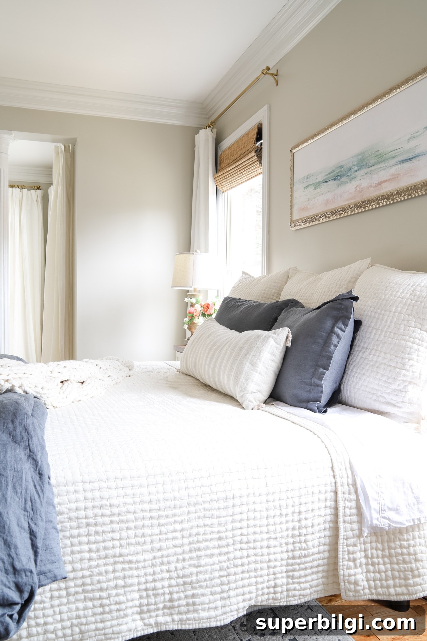 How to Make Your Bed Like a Pro in 6 Steps 5 Master Bedroom with Blue and White Bedding