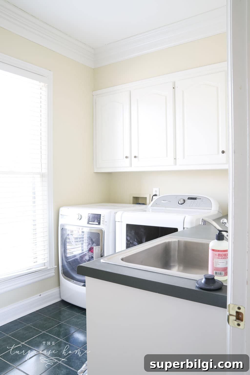 One-Year Home Makeover: Before and After Tour 3 Laundry room with hunter green tiles and countertops