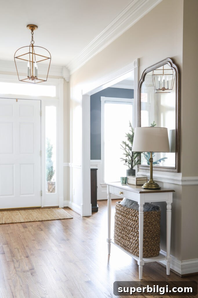 An Organized Foyer with table, lamp and mirror!
