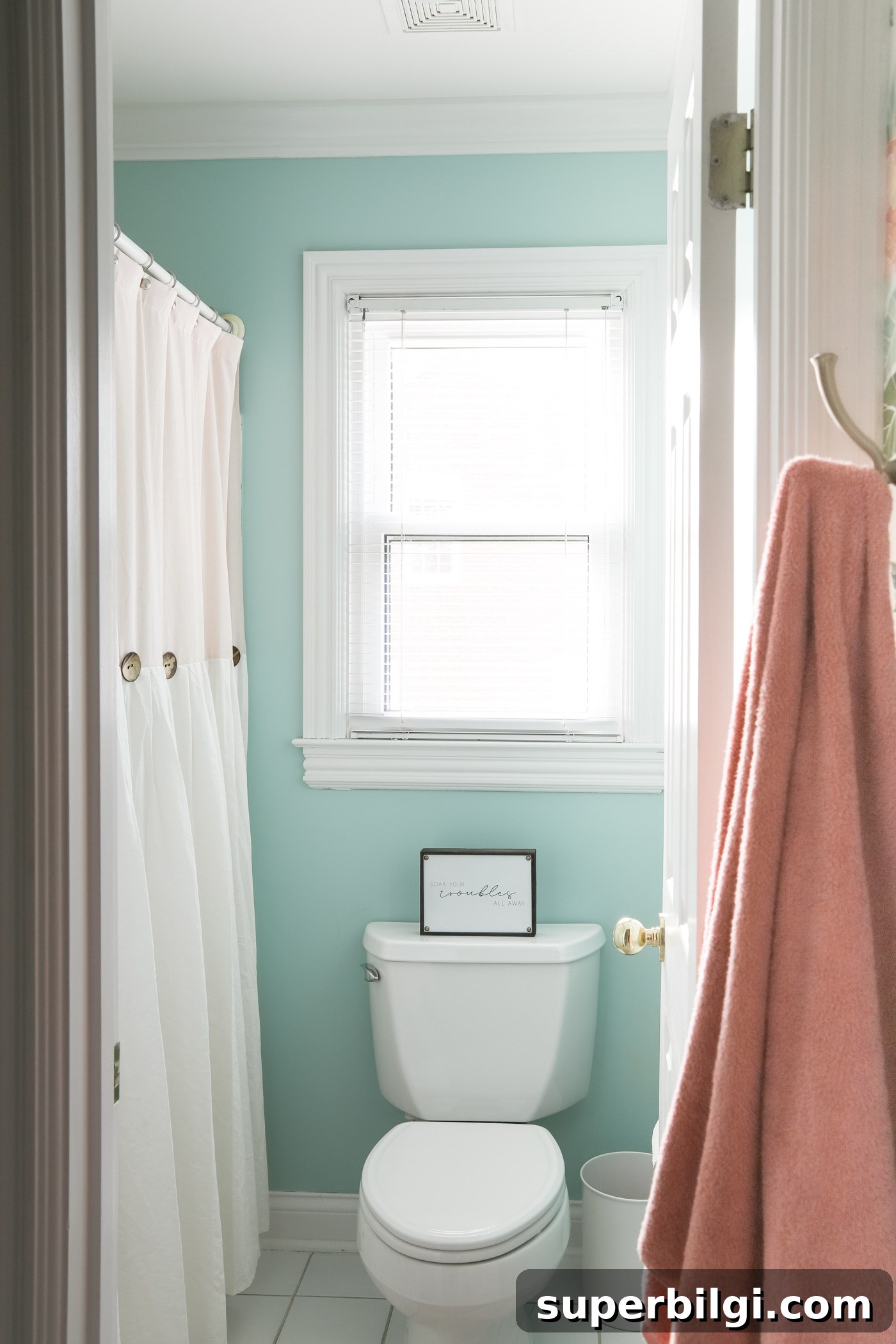 Girls' bathroom in a bright aqua satin finish