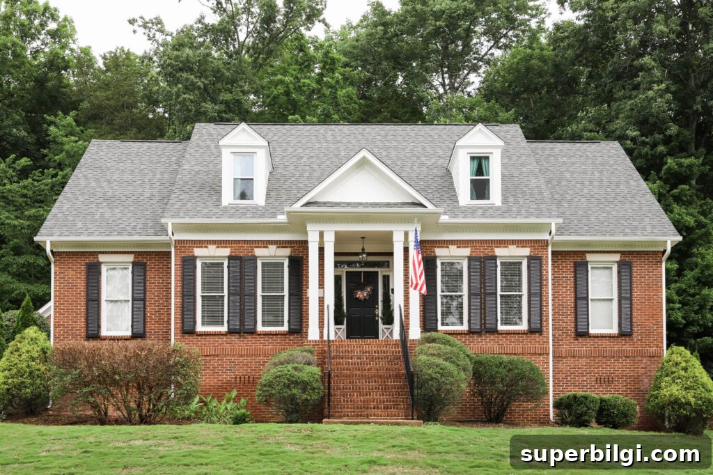 Brick Home Exterior Makeover: White Trim and Black Shutters 6 Close up of exterior brick home makeover