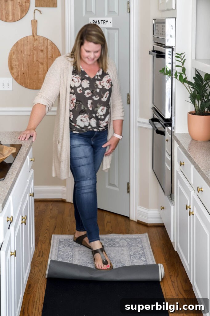 Ruggable Rug Review: Cleaning, Durability & Verdict 4 person rolling out a washable rug