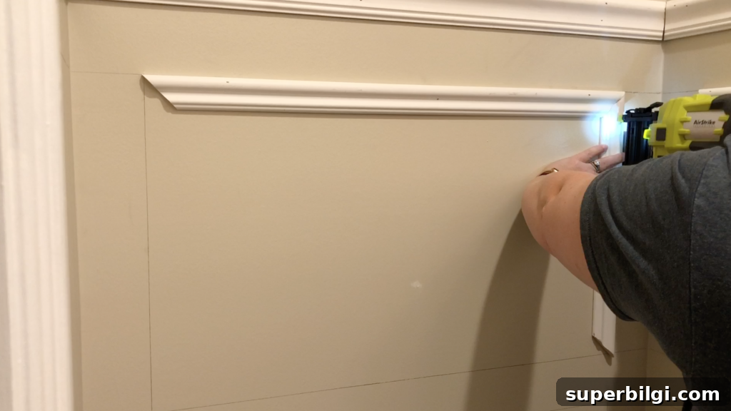 DIY Picture Frame Molding Tutorial 13 Install Trim on the Wall