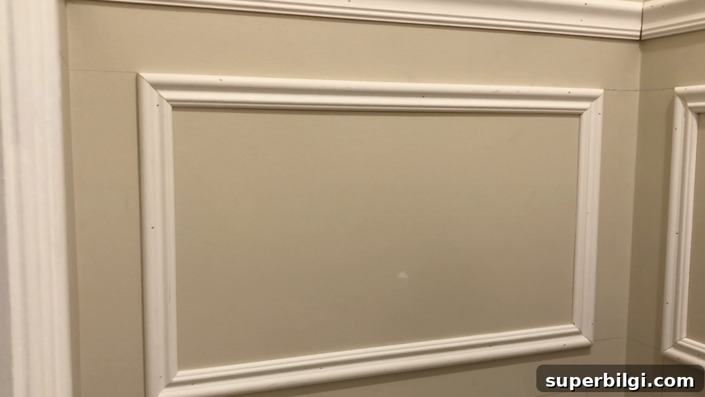 DIY Picture Frame Molding Tutorial 15 installing wall moulding