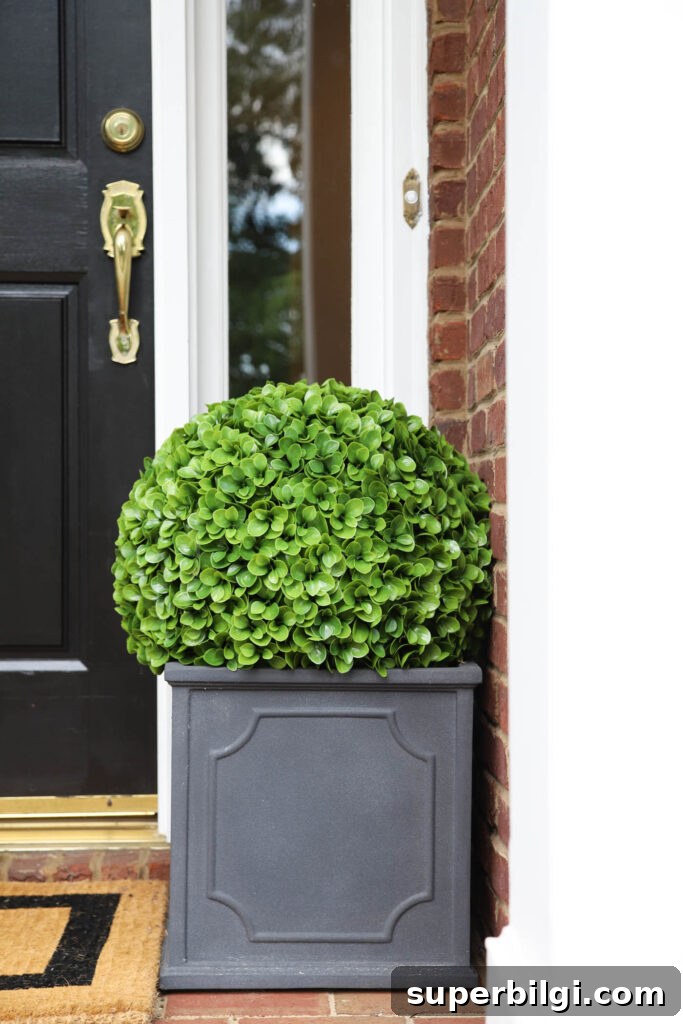 Boost Your Home's Curb Appeal With Front Yard Upgrades 11 Classic Planter with Faux Topiary Ball