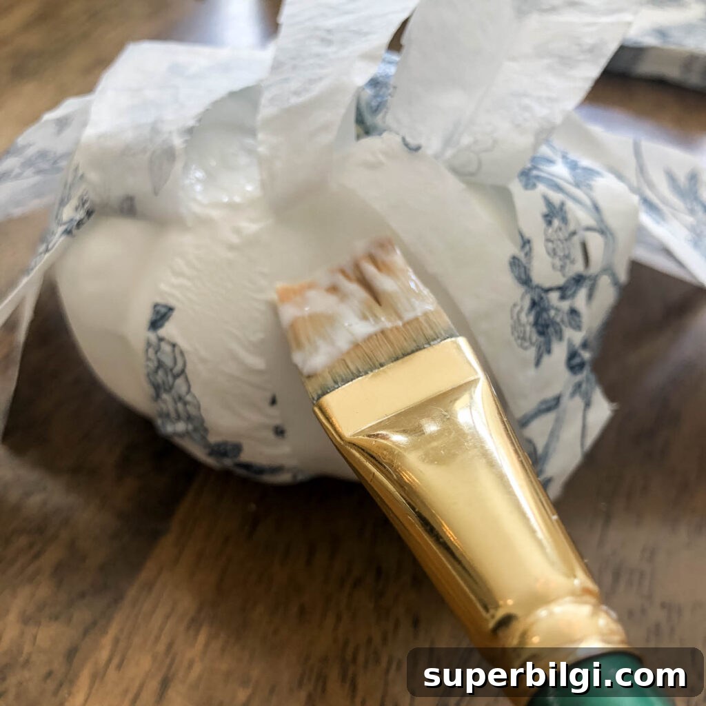 Make Chinoiserie Pumpkins: DIY Video Tutorial 9 Glue napkin sections to pumpkin