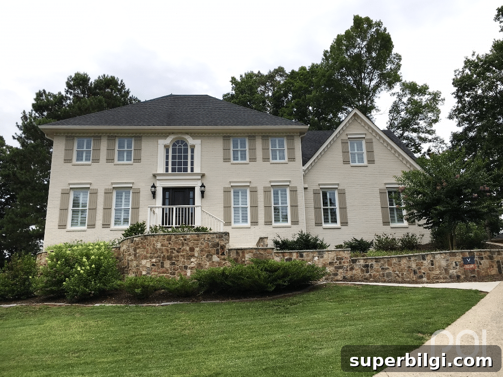 two story home with sw accessible beige painted brick