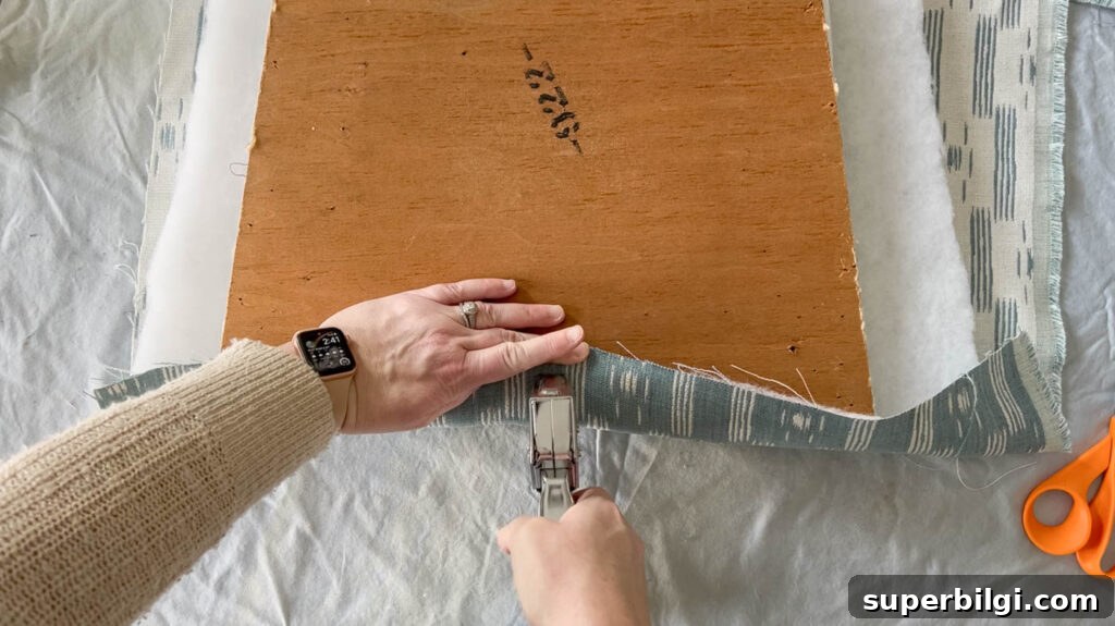 Reupholster Dining Chair Seats: Step-by-Step DIY 12 Staple the Underside of the Chair