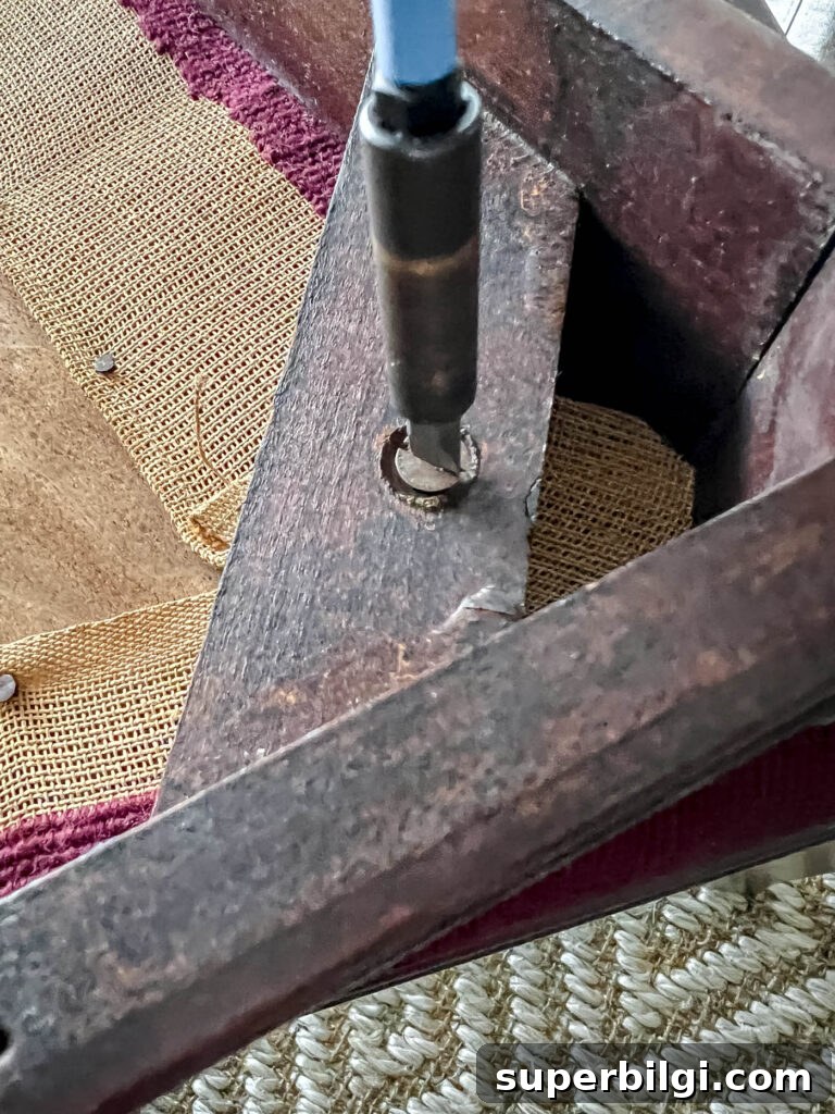 Reupholster Dining Chair Seats: Step-by-Step DIY 5 Remove the seat from the chair