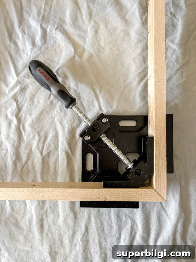 How to Build a Custom Frame for Your Frame TV 4 Clamp corners with 1" x 2" angled boards