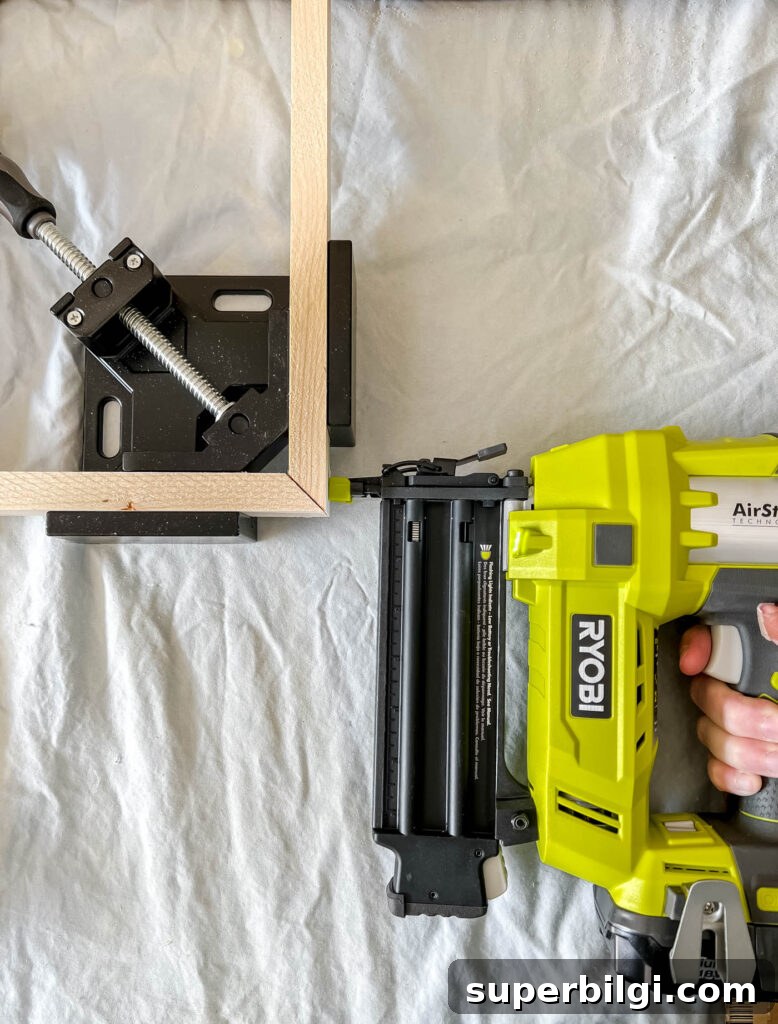 How to Build a Custom Frame for Your Frame TV 5 stapling the wood frame