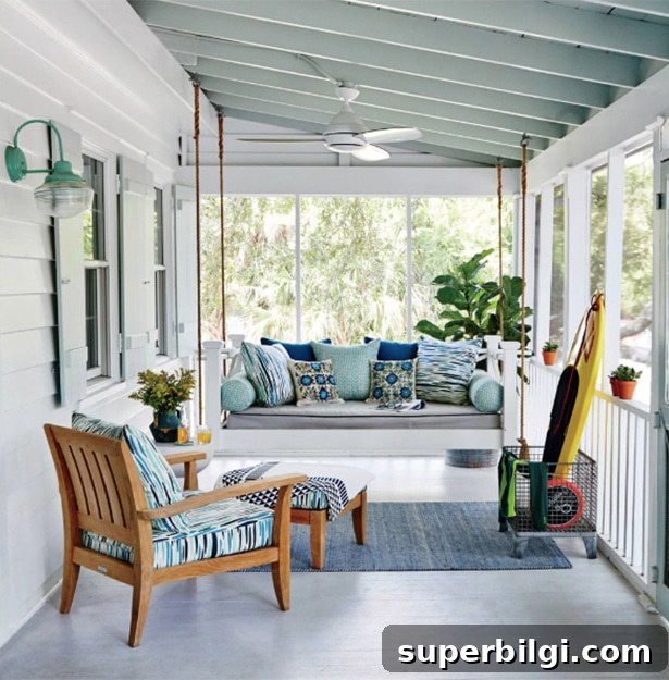 throw pillows decorating the furniture in a screened-in porch