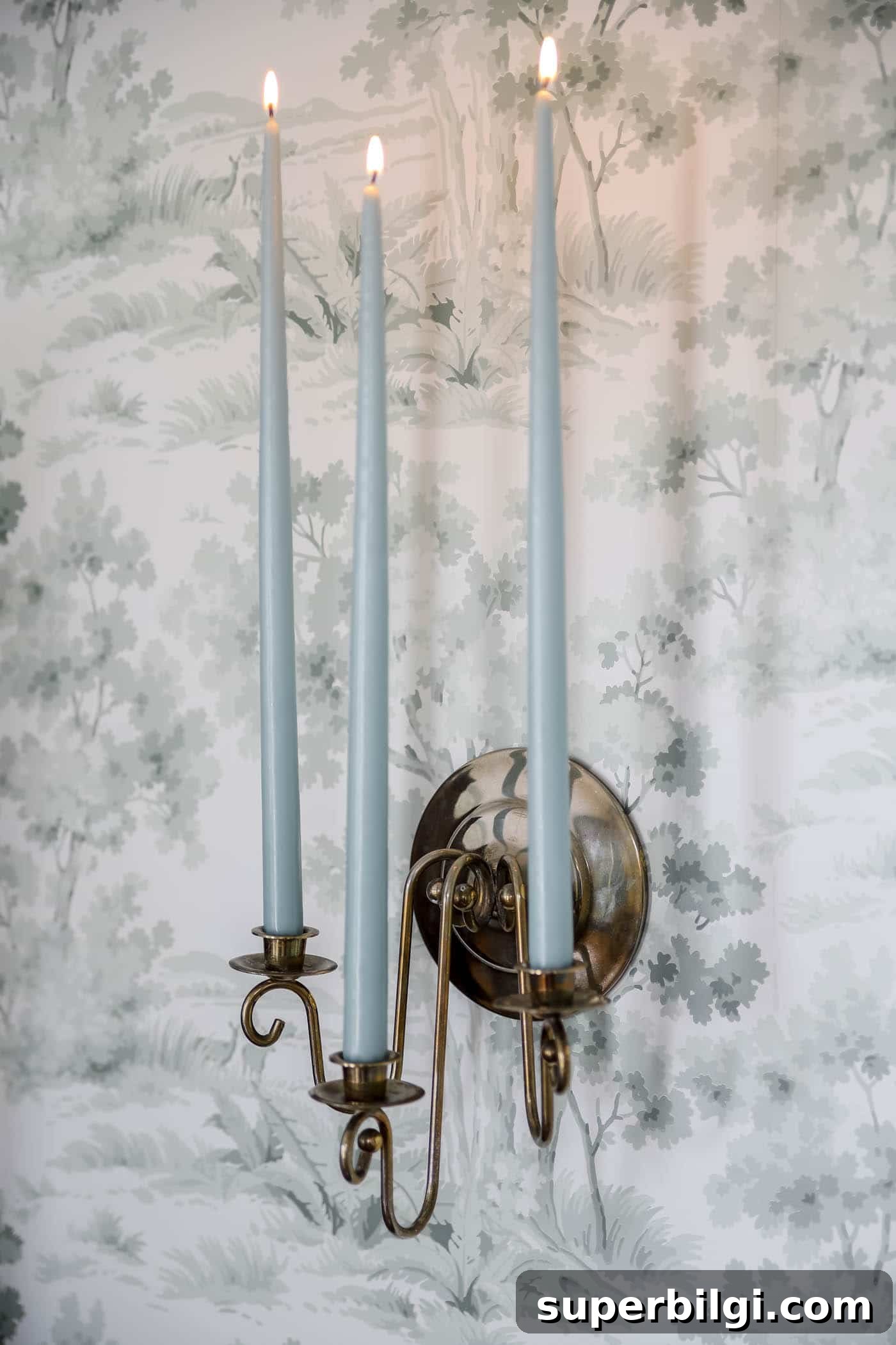 Blue candles in vintage candle sconce