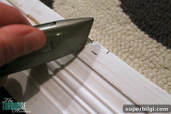 Frame a Builder-Grade Mirror: DIY Bathroom Upgrade 5 This simple DIY is easy and cheap! LOVE the custom look! | How to Frame a Builder-Grade Mirror | TheTurquoiseHome.com