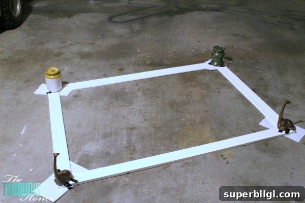 Frame a Builder-Grade Mirror: DIY Bathroom Upgrade 7 This simple DIY is easy and cheap! LOVE the custom look! | How to Frame a Builder-Grade Mirror | TheTurquoiseHome.com