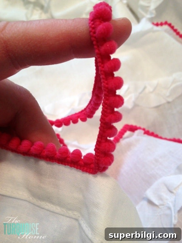 Sweet Nursery Curtains with No-Sew Pom Pom Trim | TheTurquoiseHome.com