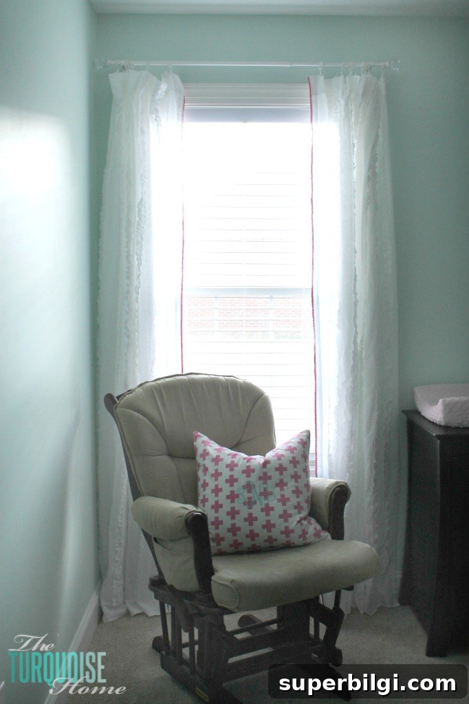 I love the little detail of the pom pom trim. And it's no-sew, my favorite!! Sweet Nursery Curtains with No-Sew Pom Pom Trim | TheTurquoiseHome.com